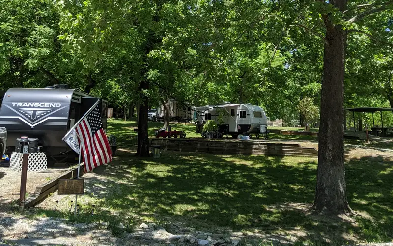 Two campers set up in campsites at Beaver RV Park and Campground